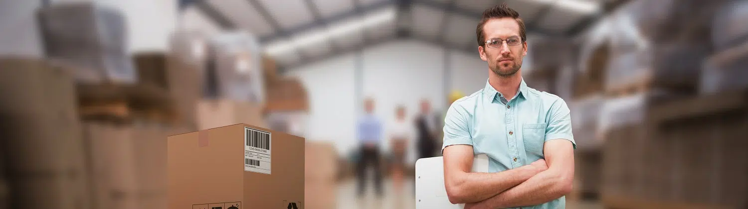 composite 3d image of serious warehouse manager standing with arms crossed against warehouse managers and worker talking together